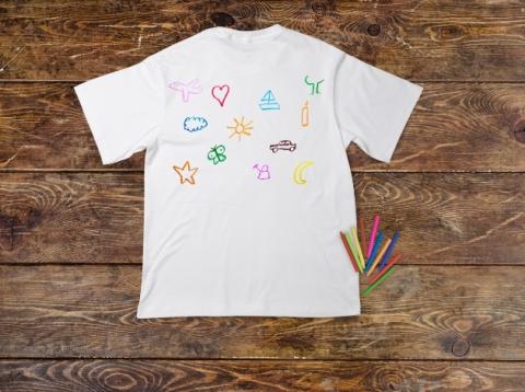 design your own t-shirt. graphic of a white t shirt with artistic doodles on the front of it. 