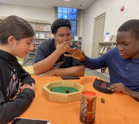 Teens playing a board games