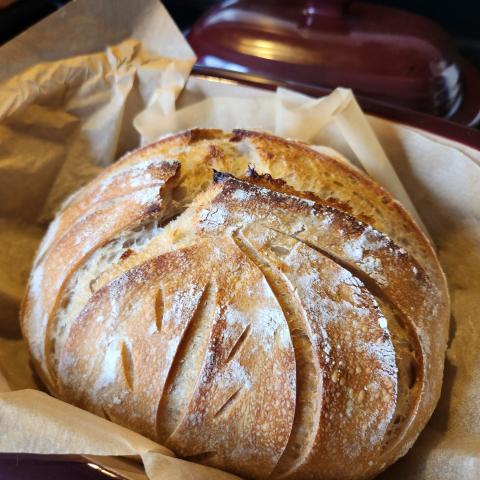 third wednesday sourdough loaf on brown craft paper