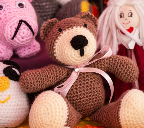 Crocheted teddy bear and other toys.