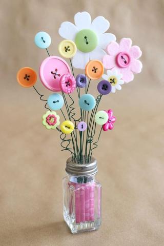 image of flowers made of buttons in a salt shaker