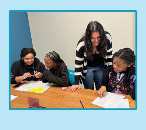 Teens looking at poetry.
