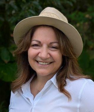 photo of women in hat smiling