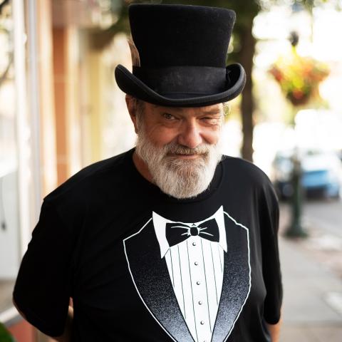image of bearded man with top hat and tuxedo shirt