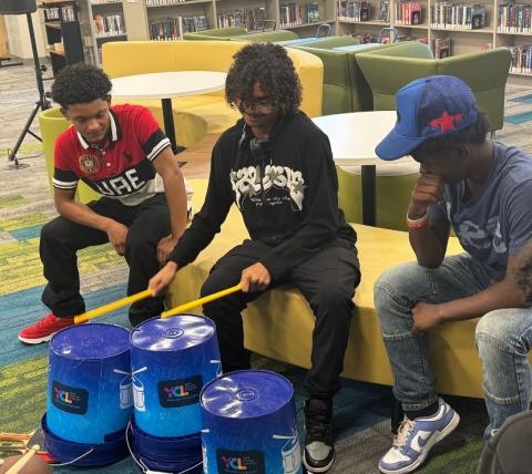 Teen males drumming