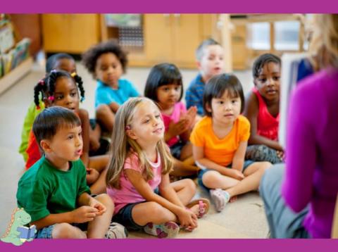 diverse group of young children sitting on the floor listening to a staory