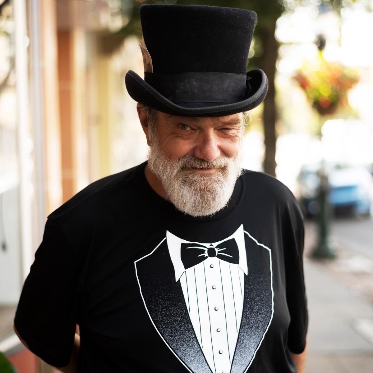image of bearded man with top hat and tuxedo shirt