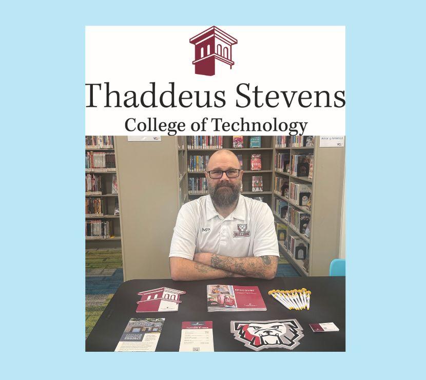 Man sitting at a table from a college.