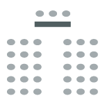 Audience/chairs facing a table of panelists at the front of the room. Panelists are seated behind the table.